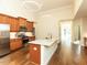 Modern kitchen with stainless steel appliances, granite countertops, and hardwood floors at 103 Thornwhistle Pl, Garner, NC 27529