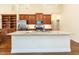Bright kitchen featuring granite countertops, stainless steel appliances, and ample storage at 103 Thornwhistle Pl, Garner, NC 27529