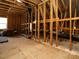 Unfinished attic space showing exposed wooden beams, potential for customization and extra storage at 107 Canary Ct, Raleigh, NC 27610