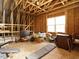 Unfinished attic featuring exposed rafters and beams, with ample space for customization and storage solutions at 107 Canary Ct, Raleigh, NC 27610