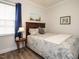Cozy bedroom featuring a queen-sized bed, soft lighting, and tranquil decor at 107 Canary Ct, Raleigh, NC 27610