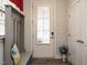 Bright foyer featuring a coat rack and a glass-paneled front door, offering a warm welcome at 107 Canary Ct, Raleigh, NC 27610