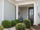 Inviting front porch with charming chairs and lush landscaping, perfect for relaxing outdoors at 107 Canary Ct, Raleigh, NC 27610