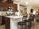 Kitchen with seating at island, modern stainless appliances, subway tile backsplash, and ample storage at 107 Canary Ct, Raleigh, NC 27610