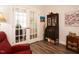 Comfortable living room with French doors, vintage furnishings, and great natural light at 107 Canary Ct, Raleigh, NC 27610