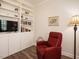 Cozy living room featuring custom built-in shelves, providing stylish storage and display space at 107 Canary Ct, Raleigh, NC 27610