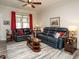 Comfortable living room with ceiling fan, leather sofas, and stylish decor, perfect for relaxing at 107 Canary Ct, Raleigh, NC 27610