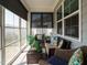 Inviting sunroom with ample natural light and comfortable seating, perfect for relaxing and enjoying the outdoors from inside at 107 Canary Ct, Raleigh, NC 27610