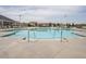 Resort-style swimming pool featuring pristine water, plenty of lounge chairs, and ample space for relaxation at 107 Canary Ct, Raleigh, NC 27610