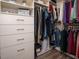 Walk-in closet with custom shelving and drawer units for efficient storage and organization at 107 Canary Ct, Raleigh, NC 27610