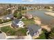 Stunning aerial view of the neighborhood featuring homes around a pond and lush landscaping at 107 Zaharis Cv, Raleigh, NC 27603