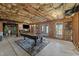 Unfinished basement space with room for entertaining and a pool table with exposed ceilings at 107 Zaharis Cv, Raleigh, NC 27603