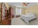 Bright bedroom with a ceiling fan, wooden furniture, and a comfortable bed at 107 Zaharis Cv, Raleigh, NC 27603