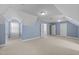 Large bonus room with three doors and a window for ample natural light at 107 Zaharis Cv, Raleigh, NC 27603