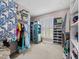 Spacious walk-in closet with ample shelving and clothing storage, offering organization and style at 107 Zaharis Cv, Raleigh, NC 27603