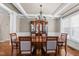 Elegant dining room features coffered ceilings, hardwood floors, and bright windows at 107 Zaharis Cv, Raleigh, NC 27603