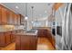 Modern kitchen with granite countertops, an island cooktop, and stainless steel appliances at 107 Zaharis Cv, Raleigh, NC 27603