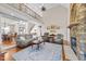 Spacious living room featuring a stone fireplace, wood floors, and elegant furnishings at 107 Zaharis Cv, Raleigh, NC 27603