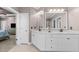 Spacious bathroom features dual vanities, white cabinetry, and ample counter space at 107 Zaharis Cv, Raleigh, NC 27603