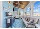Charming sunroom with wood ceiling, blue walls, and scenic outdoor views at 107 Zaharis Cv, Raleigh, NC 27603