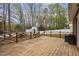 Backyard featuring a wooden deck with an ornate fence and a white shed in the background at 1108 Medlin Dr, Cary, NC 27511