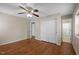 Bright bedroom with hardwood floors, closet, and a ceiling fan at 1108 Medlin Dr, Cary, NC 27511