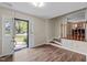 Entryway featuring hardwood floors, a bright entrance with large window in the door, and stairs leading to the dining room at 1108 Medlin Dr, Cary, NC 27511
