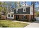 Charming two-story home with brick and siding, dormer windows, landscaped front yard, and a walkway to the front door at 1108 Medlin Dr, Cary, NC 27511