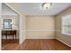 Bright room with hardwood floors, large windows, and chair rail at 1108 Medlin Dr, Cary, NC 27511