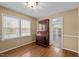 Office with hardwood flooring, ample natural light, and a classic wooden desk at 1108 Medlin Dr, Cary, NC 27511
