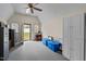 Spacious shed interior with a ceiling fan, neutral paint and vinyl flooring at 1108 Medlin Dr, Cary, NC 27511