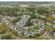 Aerial shot of a well-planned residential community, showcasing the landscaping and building layout at 1116 Silky Dogwood Trl, Apex, NC 27502