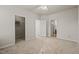 Spacious bedroom with neutral carpet provides multiple doorways to closets and bathroom at 1116 Silky Dogwood Trl, Apex, NC 27502