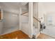 Entryway boasting hardwood floors, staircase, and views of living room and fireplace at 1116 Silky Dogwood Trl, Apex, NC 27502