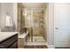 Modern bathroom showcasing a glass-enclosed shower with tile surround and built-in bench seating at 112 Willow Grove Ln, Fuquay Varina, NC 27526