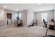 Bonus room featuring carpet, neutral paint, and plenty of natural light at 112 Willow Grove Ln, Fuquay Varina, NC 27526