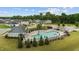 Gorgeous community pool and pool house with lounge chairs for relaxing at 112 Willow Grove Ln, Fuquay Varina, NC 27526