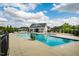 Stunning view of the community pool and clubhouse with ample lounge seating at 112 Willow Grove Ln, Fuquay Varina, NC 27526