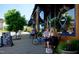 Street view with people sitting outside bakery cafe with blue awning and large window at 112 Willow Grove Ln, Fuquay Varina, NC 27526