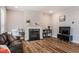 Comfortable living room features a fireplace, wood floors, and plenty of natural light for a welcoming atmosphere at 112 Willow Grove Ln, Fuquay Varina, NC 27526