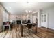 Open concept living room and dining area with wood floors and a fireplace at 112 Willow Grove Ln, Fuquay Varina, NC 27526