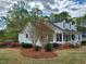 Well-maintained home featuring manicured landscaping, a welcoming front porch, and classic architectural details at 117 Linwood Ln, Clayton, NC 27527