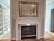 Cozy fireplace with a decorative mantel and marble surround for added charm at 117 Linwood Ln, Clayton, NC 27527