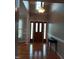 A grand foyer features hardwood floors, a center light fixture, and a doorway with decorative glass at 117 Linwood Ln, Clayton, NC 27527