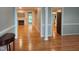 Open-concept interior featuring hardwood floors, a fireplace, and natural light, creating a warm and inviting atmosphere at 117 Linwood Ln, Clayton, NC 27527