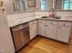 Kitchen includes stainless steel appliances, granite countertops, and white cabinetry at 117 Linwood Ln, Clayton, NC 27527