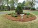 Lush landscaping featuring a bird bath and well-maintained plants, creating a serene outdoor space at 117 Linwood Ln, Clayton, NC 27527