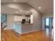 Inviting living room with vaulted ceiling, fan, and seamless connection to the modern kitchen at 117 Linwood Ln, Clayton, NC 27527