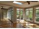 Bright living room with hardwood floors, skylights, and large windows overlooking the garden at 117 Linwood Ln, Clayton, NC 27527