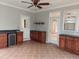 Sunroom featuring custom cabinets, a sink, a mini fridge and access to the backyard at 117 Linwood Ln, Clayton, NC 27527